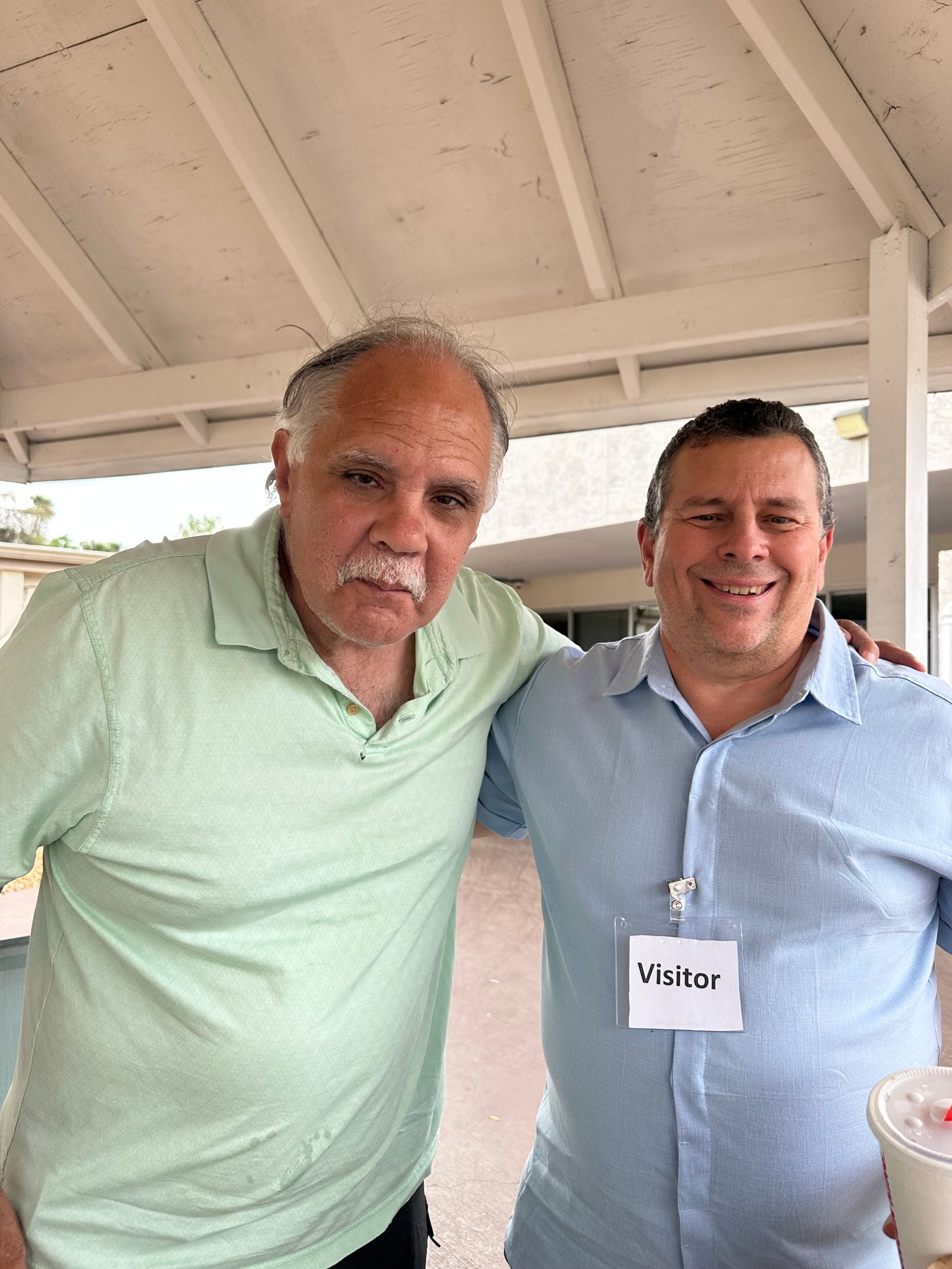 Church member visiting with an elderly man