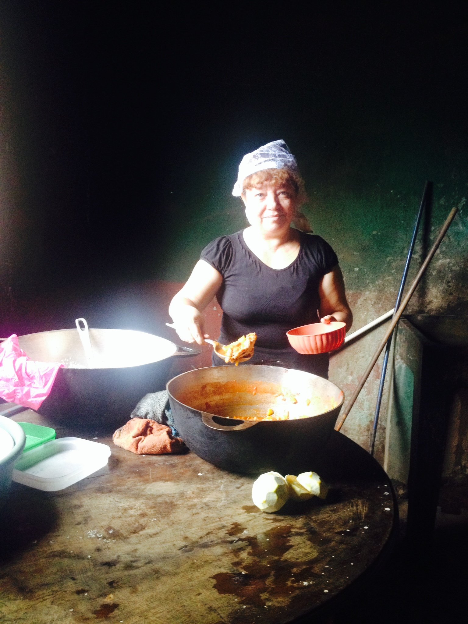 Woman preparing food for children in Nicaragua